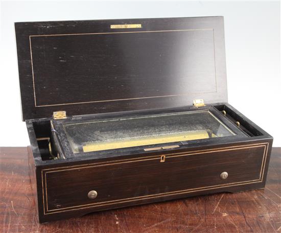 A 19th century Swiss inlaid rosewood musical box, 19in.